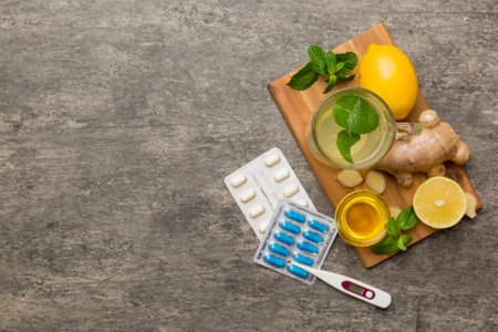 Natural cold and flu home remedies. Natural ingredients for immunity stimulation and viruses protection. top view flat lay.の写真素材