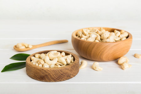 cashew nuts in wooden bowl on table background. top view. Space for text. healthy foodの写真素材