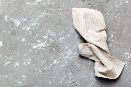 top view with gray kitchen napkin isolated on table background. Folded cloth for mockup with copy space, Flat lay. minimal style.の写真素材