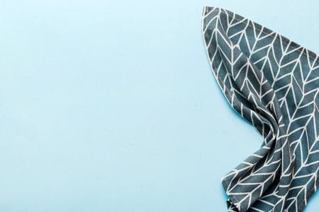 top view with blue kitchen napkin isolated on table background. Folded cloth for mockup with copy space, Flat lay. minimal style.の写真素材