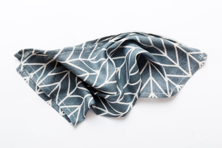 top view with blue kitchen napkin isolated on table background. Folded cloth for mockup with copy space, Flat lay. minimal style.の写真素材