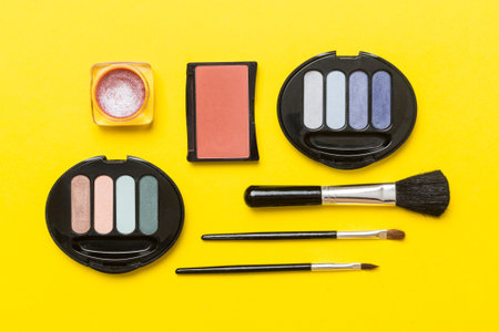 professional makeup tools. top view. flat lay. Beauty, decorative cosmetics. Makeup brushes set and color eyeshadow palette on table background. minimalistic style.の写真素材