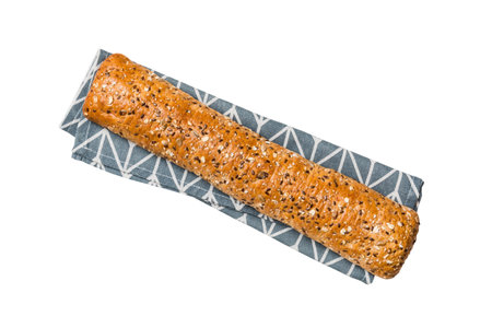 Freshly baked delicious french bread with napkin isolated on white background top view. Healthy...