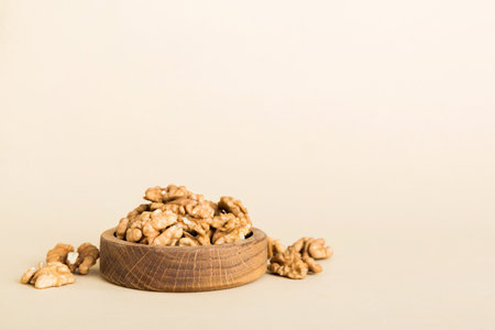 Fresh healthy walnuts in bowl on colored table background. Top view Healthy eating bertholletia concept. super foods.の写真素材