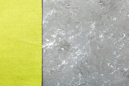 top view with green kitchen napkin isolated on table background. Folded cloth for mockup with copy space, Flat lay. minimal style.の写真素材