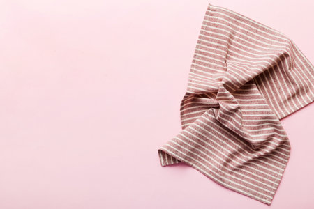 top view with red empty kitchen napkin isolated on table background. Folded cloth for mockup with copy space, Flat lay. minimal style.の写真素材