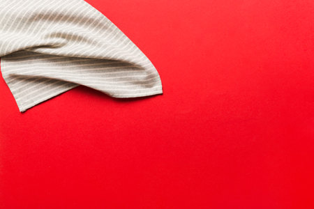 top view with gray kitchen napkin isolated on table background. Folded cloth for mockup with copy space, Flat lay. minimal style.の写真素材