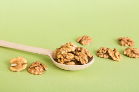 Fresh healthy walnuts in bowl on colored table background. Top view Healthy eating bertholletia concept. super foods.の写真素材