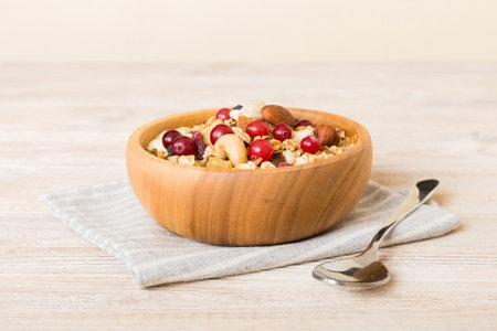 Cooking a wholesome breakfast. Granola with Various dried fruits and nuts in a bowl. The concept of a healthy dessert. Flat lay, top view with copy space.の写真素材