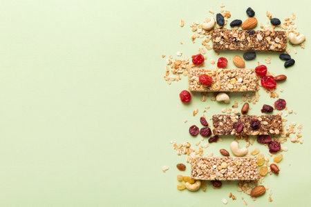 Various granola bars on table background. Cereal granola bars. Superfood breakfast bars with oats, nuts and berries, close up. superfood concept.の写真素材