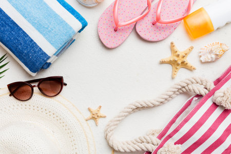 Summer vacation concept flat lay. beach accessories and towel top view. Space for text. travel...
