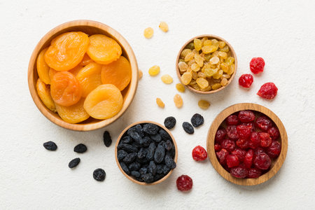 Bowl with different dried fruits on table background, top view. Healthy lifestyle with copy space.の写真素材