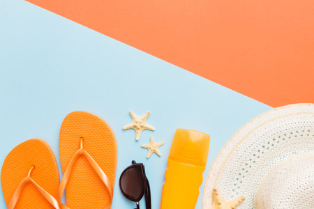Summer vacation concept flat lay. straw hat beach accessories and flip flop top view. Space for text. travel concept.の写真素材