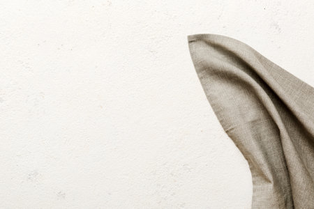 top view with gray kitchen napkin isolated on table background. Folded cloth for mockup with copy space, Flat lay. minimal style.の写真素材