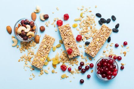 Various granola bars on table background. Cereal granola bars. Superfood breakfast bars with oats, nuts and berries, close up. superfood concept.の写真素材