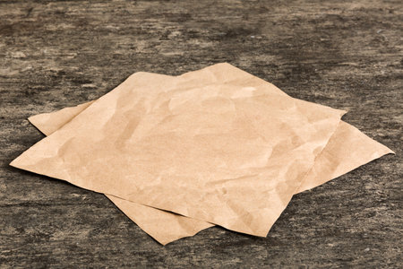 top view with baking parchment empty on table background. Folded cloth for mockup with copy space, Flat lay. minimal style.の写真素材