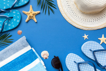 Summer vacation concept flat lay. straw hat beach accessories and towel top view. Space for text. travel concept.の写真素材