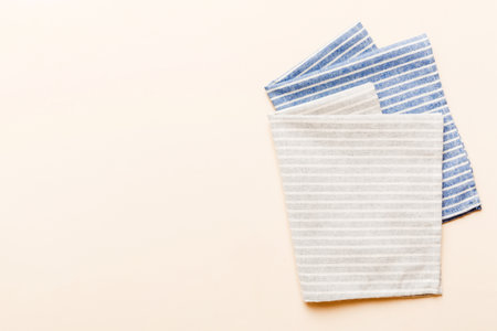top view with gray kitchen napkin isolated on table background. Folded cloth for mockup with copy space, Flat lay. minimal style.の写真素材