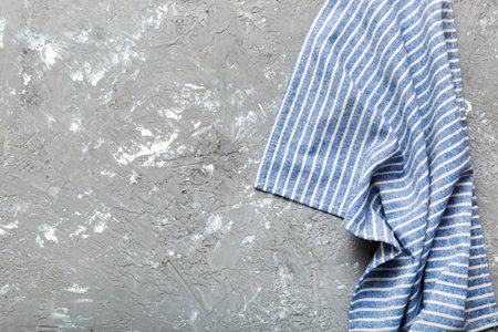 top view with blue kitchen napkin isolated on table background. Folded cloth for mockup with copy space, Flat lay. minimal style.の写真素材