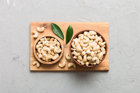 cashew nuts in wooden bowl on table background. top view. Space for text. healthy foodの写真素材