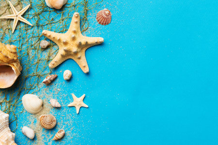 Summer time concept Flat lay composition with beautiful starfish and sea shells on colored table,...
