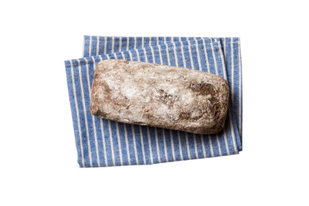 Freshly baked delicious french bread with napkin isolated on white background top view. Healthy white bread loaf.の写真素材
