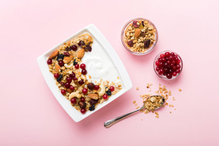 Healthy breakfast food with granola, yogurt, fruits and nuts. Dessert parfait with dried fruits for breakfast.の写真素材