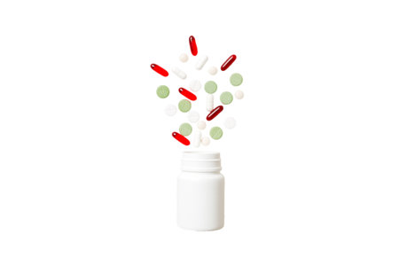 Multicolored pills and capsules in plastic bottle on Colored background, copy space. Many different...
