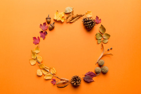 Autumn composition made of dried leaves, cones and acorns on table. Flat lay, top view, copy space.