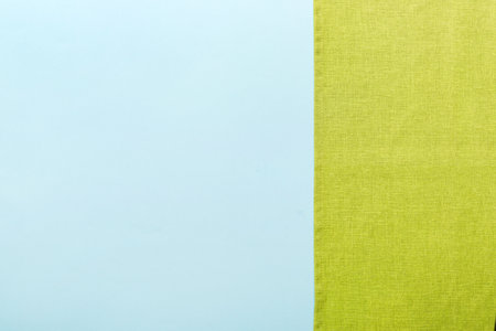 top view with green kitchen napkin isolated on table background. Folded cloth for mockup with copy space, Flat lay. minimal style.の写真素材
