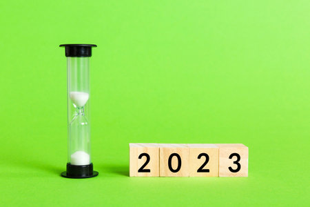 New Year 2023 sand timer. Resolution, time, plan, goal, motivation, reboot, countdown and New Year holiday concepts. Hourglass number 2023.の写真素材