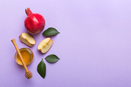 Flat lay composition with symbols jewish Rosh Hashanah holiday attributes on colored background, Rosh hashanah concept. New Year holiday Traditional. Top view with copy space.の写真素材