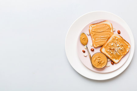 Peanut butter sandwiches or toasts on light table background.Breakfast. Vegetarian food. American cuisine top view with copy space.の写真素材