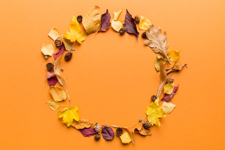 Autumn composition made of dried leaves, cones and acorns on table. Flat lay, top view.の写真素材