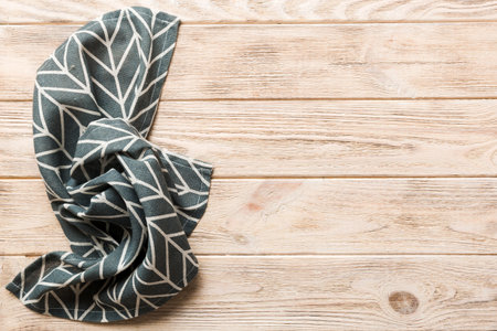 top view with blue kitchen napkin isolated on table background. Folded cloth for mockup with copy space, Flat lay. minimal style.の写真素材