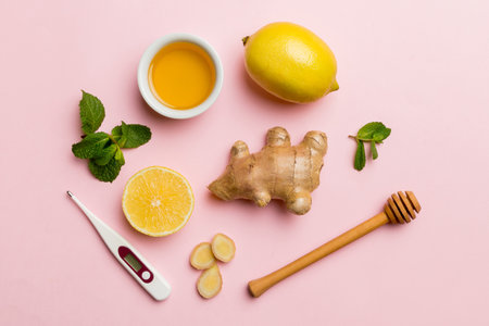 Natural cold and flu home remedies and thermometer. Natural ingredients for immunity stimulation and viruses protection. top view flat lay.の写真素材
