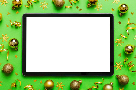 Christmas online shopping from home tablet pc with blank white display top view. Tablet with copy...