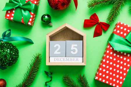 Christmas calendar 25 december. Christmas gift, fir branches, pine cones. Flat lay, top view. New...