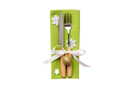 isolated christmas Plate with decor and fork and spoon. new year holiday background. top view.