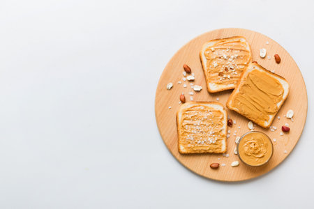Peanut butter sandwiches or toasts on light table background.Breakfast. Vegetarian food. American cuisine top view with copy space.の写真素材