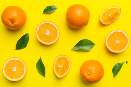 Fruit pattern of fresh orange slices on colored background. top view. copyspace. creative summer...