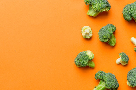 Broccoli scattered on white wooden table.copy space.Top viewの写真素材