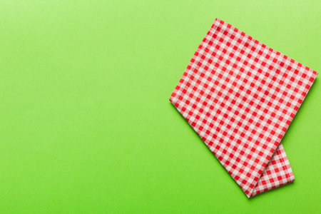 top view with red empty kitchen napkin isolated on table background. Folded cloth for mockup with copy space, Flat lay. minimal style.の写真素材