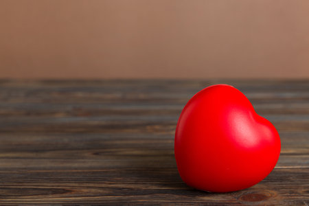 gift box with red bow and red heart on colored background. perspective view. flat lay.の写真素材