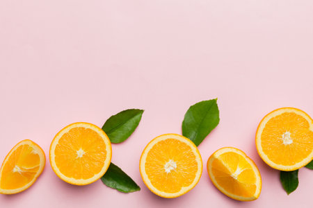 fresh Fruit orange slices on colored background. top view. copyspace. creative summer concept. Half...