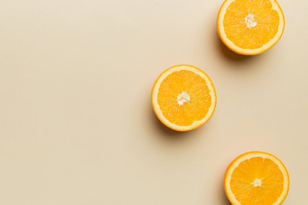 fresh Fruit orange slices on colored background. top view. copyspace. creative summer concept. Half of citrus in minimal flat lay with copy space.の写真素材