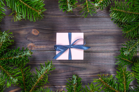 Christmas gift box. Christmas present at white wooden table. Flat lay with copy space.の写真素材