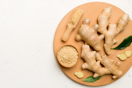 ginger on cutting board table, top view. Space for text.の写真素材