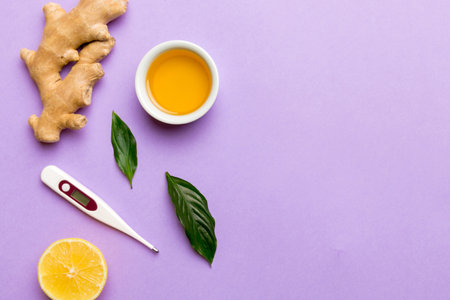 Natural cold and flu home remedies and thermometer. Natural ingredients for immunity stimulation and viruses protection. top view flat lay.の写真素材