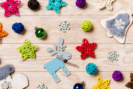Top view of Christmas toys on wooden background. New Year ornament. Holiday concept.の写真素材